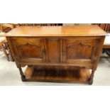 A good quality reproduction golden oak side cabinet in the manor of Titchmarsh and Goodwin with