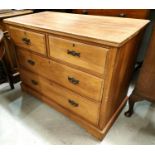 An Edwardian satin walnut chest of 2 long and 2 short drawers