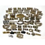 A collection of military soldier badges for various regiments etc.