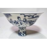 A large Chinese blue and white stem cup with traditional decoration, domestic scene trees plants