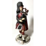 A Michael Sutty porcelain figure "Pipe Major Scots Guards" No 16, ht. 34cm