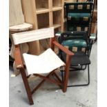 A teak 'Indian Ocean' directors/ garden chair with cream fabric, a folding garden chair and