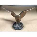 A Bronzed car mascot in the form of an eagle