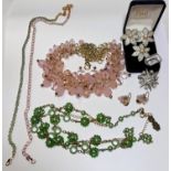 Two Butler & Wilson gilt necklaces - 1 set with opal effect stones, the other with turquoise