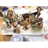 A selection of Hummel figures and other similar ceramics