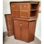 A mid 20th century teak corner cupboard with single drawer and double cupboard below by McIntosh