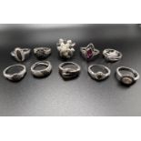 10 silver rings all set with black pave set stone chips, testing as black diamonds, some with