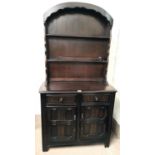 An Ercol style dark oak Dutch dresser