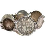 An 1884 Queen Victoria half crown bracelet with other Georgian coins forming the links