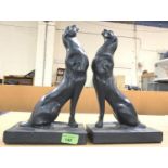 A pair of Art Deco style composition 'Austin' Italian book ends in the form of Panthers with arched
