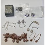 8 pairs of costume earrings, various designs and a bronze colour and pink stone bracelet