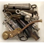 A small collection of whistles including boy scout with compass, girl guide etc