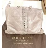 A Montini Italian designer leather shoulder bag with studded decoration and outer bag