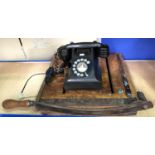 A vintage AEP Bakelite rotary telephone and a vintage wooden guillotine