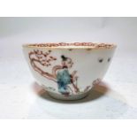 A small 18th/19th century Chinese tea bowl decorated in polychrome with figures and animals in a