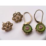 A pair of 9ct gold earrings set with a flat fern green quartz, the centre removed and set with a