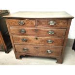 A Georgian oak chest of 3 long and 2 short graduating drawers with brass drop handles and bracket