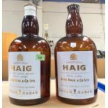 JOHN HAIG WHISKEY -  a pair of one gallon display bottles, printed enamel labels, 38cm.