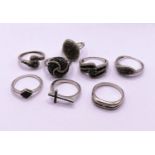 8 silver rings all set with black pave set stone chips, testing as black diamonds, some with similar