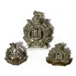 A Victorian 1898 period Scottish Boarders' Kings Own Glengarry badge; a Suffolk regiment similar;