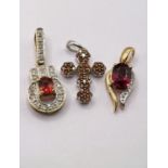 3 9 carat hallmarked gold pendants, all set with pink/red stones, one in the form of a cross, 4.3gms