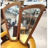 A pair mid 20th century teak framed shaped rectangular wall mirrors and an oval wall mirror with