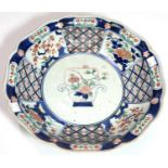 A 19th century Japanese Imari dish with scalloped and lobed edges floral decoration, circle marks to