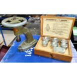 A cased set of 7 metal Robur "F-Robur" watch glass crystal fitting items and a Robur fitting tool