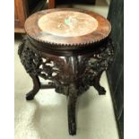 A Chinese carved and pierced wooden occasional table/ vase stand, with central marble piece floral