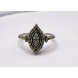 A silver dress ring with approx. 34 small diamonds in marquise shape setting and on shoulders,