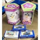 Two originally boxed Furby toys and boxed toy cars