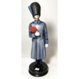 A Michael Sutty porcelain figure "Irish Guards" No 16, ht. 34cm