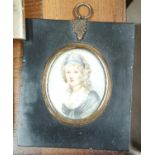 A 19th century miniature portrait of a woman in dress with scarf, in ebonised frame with gilt