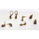 A pair of 9ct gold earrings set with 2 imperial garnets; a pair of 9ct gold studs set with pink