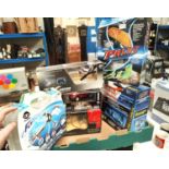 A selection of remote control vehicles, a Nikko Mini Cooper, a Salvation remote control helecopter