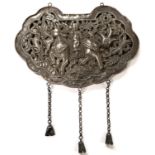 A Chinese white metal large pendant with pierced decoration of person riding dragon length 17cm