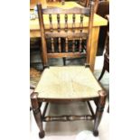 A set of 6 Lancashire spindle back dining chairs with rush seats