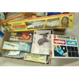 A selection of originally boxed vintage toys including "Cheerful Daschund"; Police Launch "Cheyenne"