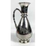 A hallmarked silver wine jug of tapering baluster form and cane effect handle, chased with herons