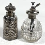 A 19th century large glass scent bottle, covered with silver spiral and embossed floral stripes,