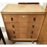 A 1930's oak veneered chest of four drawers