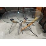 A nest of three modern circular glass and chrome tables