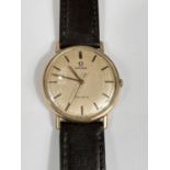 A gents circa 1960s 9ct gold backed Omega geneve swiss made mechanical wristwatch with later strap