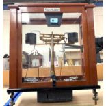 A scientific balance:  Release-o-Matic, by L Oertling, in mahogany case