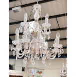 A Victorian style 12 branch 2 tier glass chandelier with cut and faceted drops