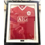 A framed and glazed MUFC shirt, signed "Barclays Premier Champions 2006-7"; a framed signed