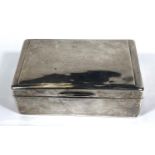 A hallmarked silver rectangular cigarette box with hinged lid and weighted base, London 1903 (some