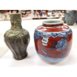 A Chinese squat vase with red and blue decoration height 22cm and an Asian stoneware vase with green