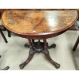 A Victorian figured walnut card table the demi-lune fold over top with marquetry inlaid