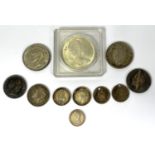 A selection of foreign silver coins including a 1965 Canada dollar